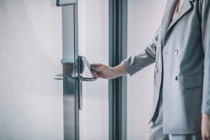 access-system-hand-woman-gray-business-suit-opening-office-door-with-pass-card_259150-40393