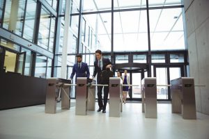 businesspeople-scanning-their-cards-turnstile-gate_107420-92030